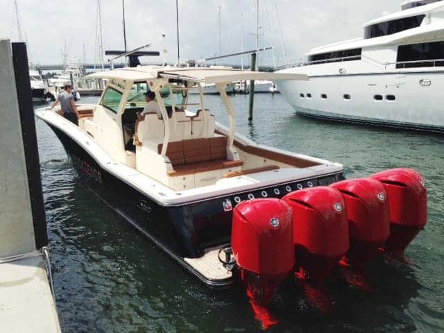 Scout with red engines as a yacht tender